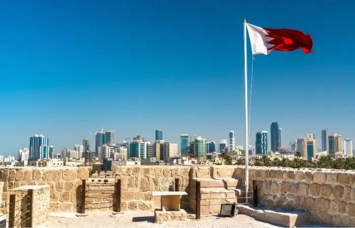 Bahrain skyline with national flag